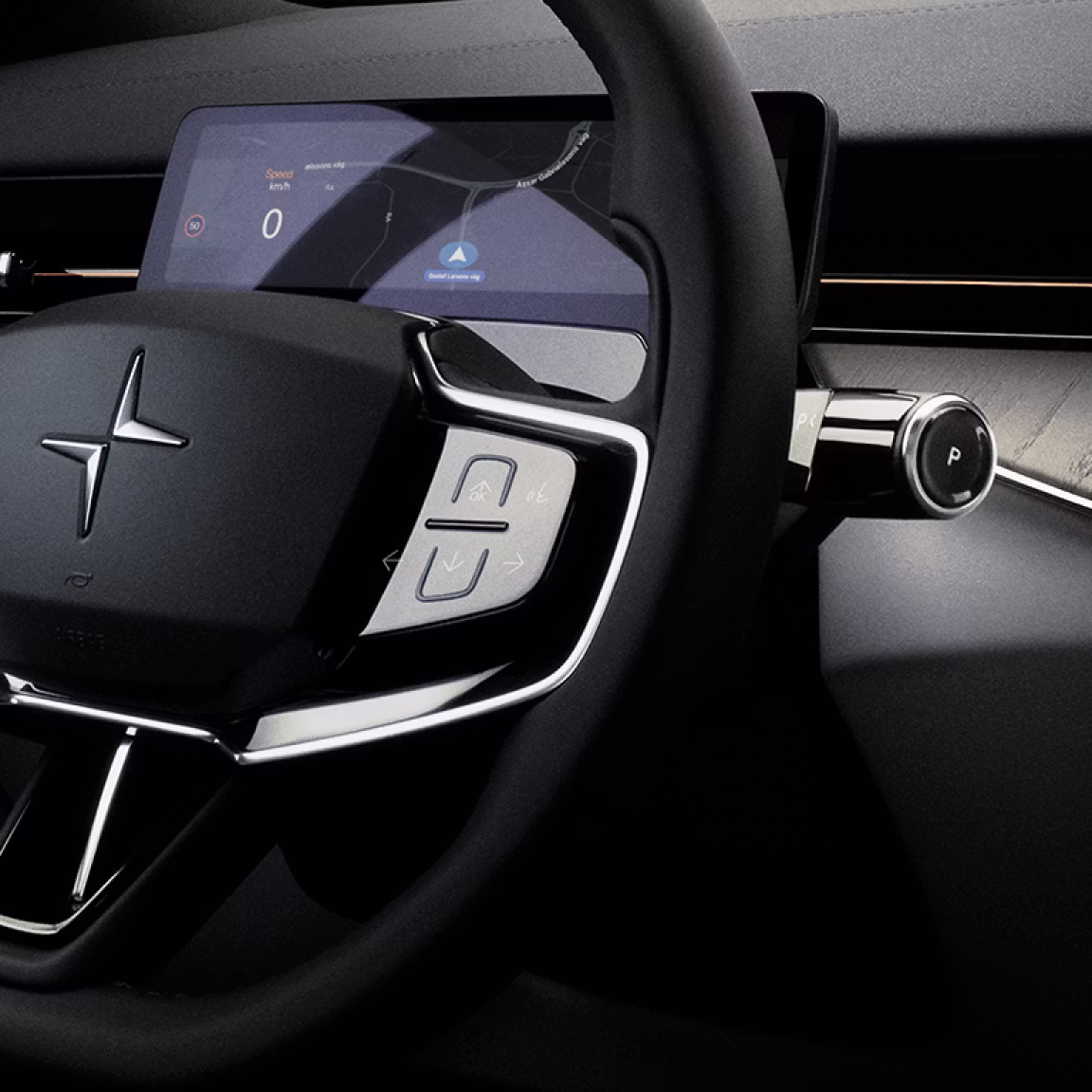 A close up of Polestar 3’s steering wheel with Polestar logo, indicator stalk, and buttons.