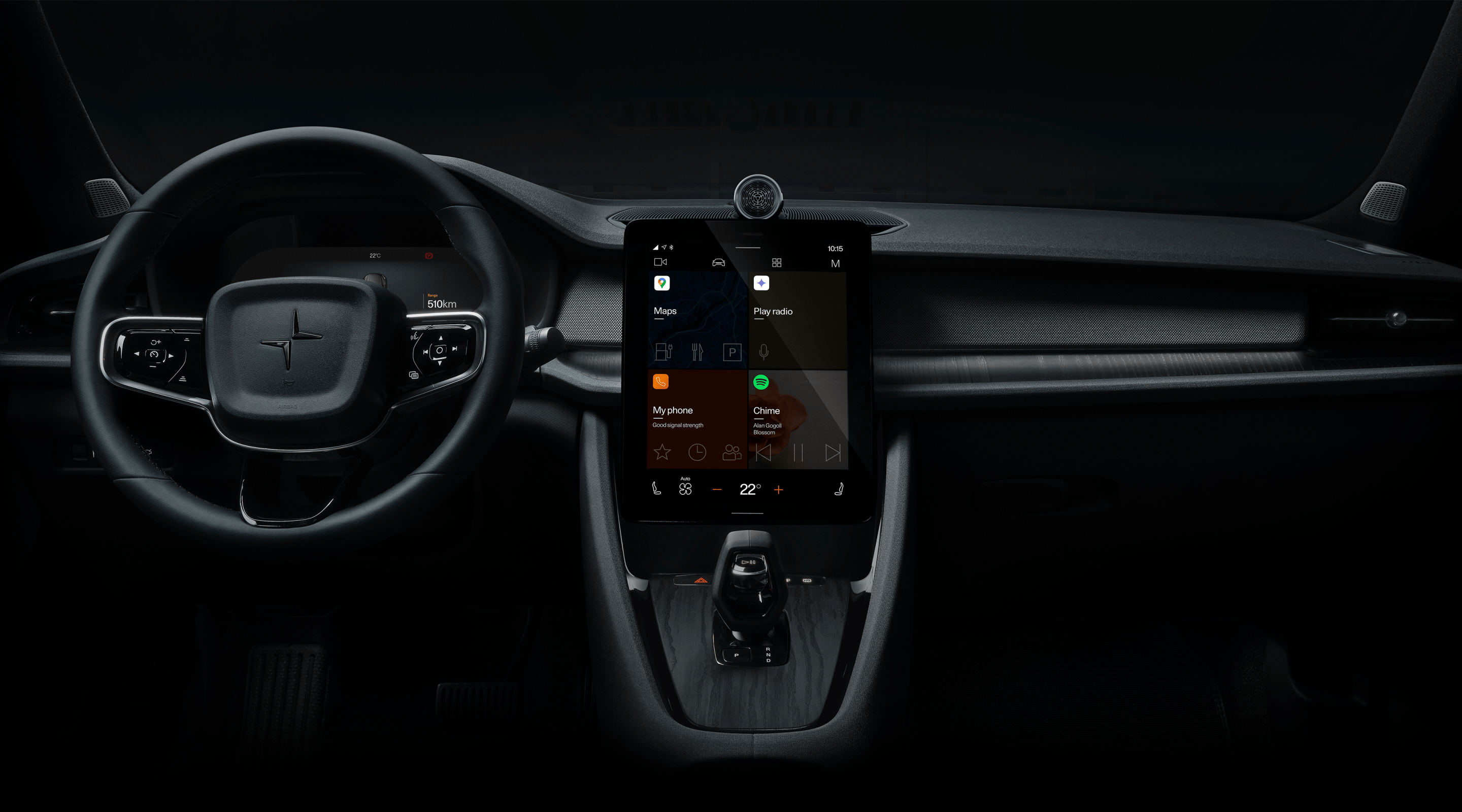 Polestar 2’s dashboard area with the steering wheel and centre display against a dark background.