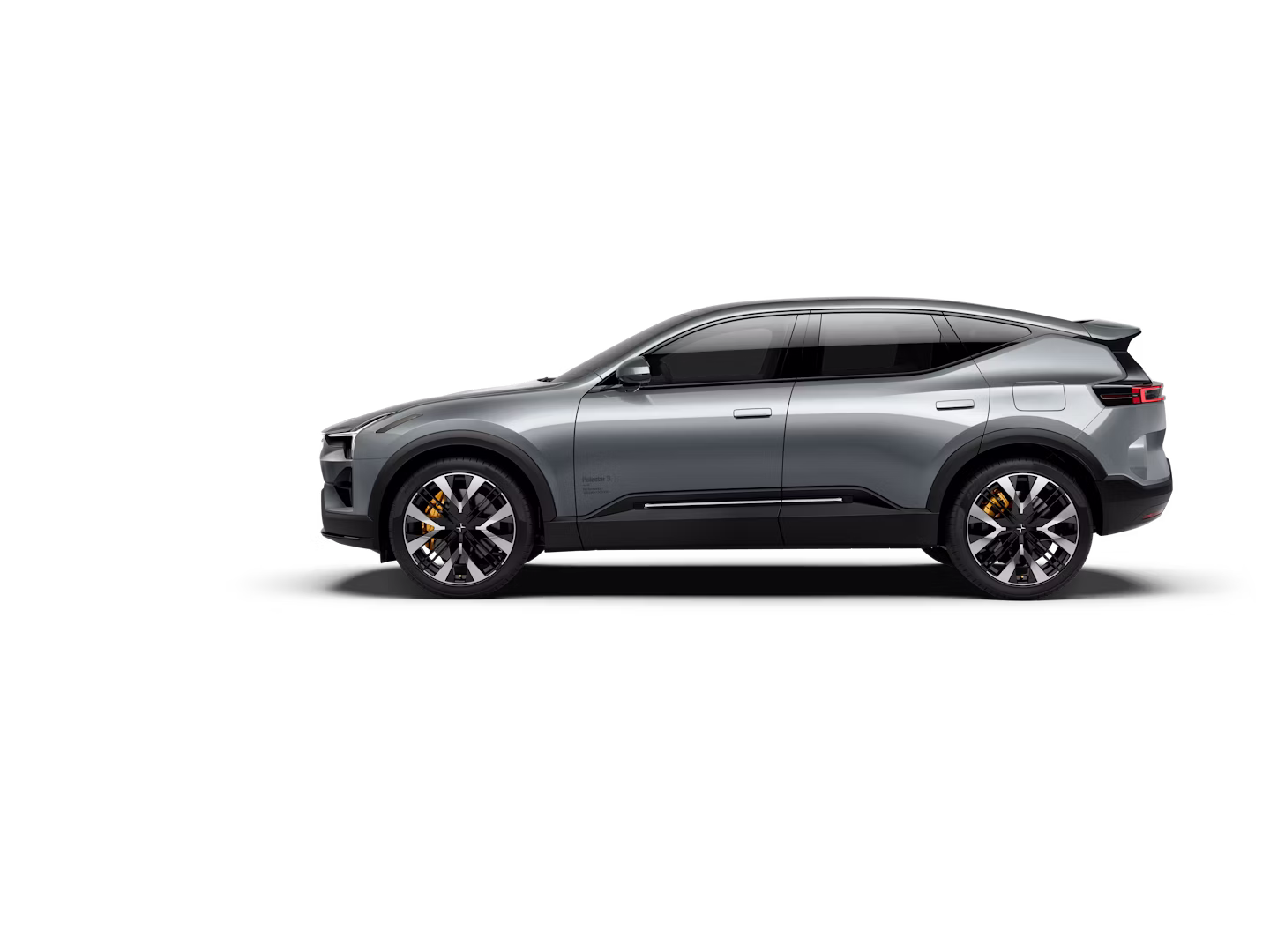 A side view of a grey-coloured Polestar 3 facing left and standing against a white background.