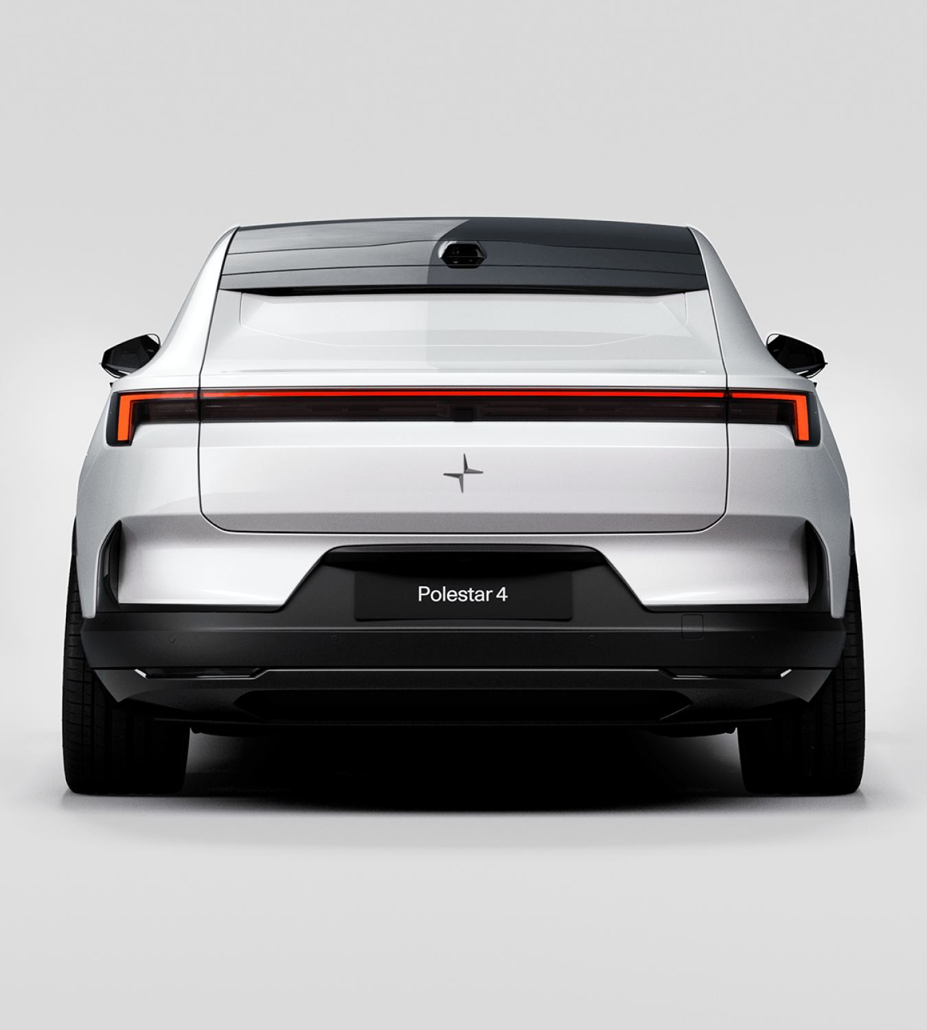 Rear view of a white Polestar 4 coupé against a white background.
