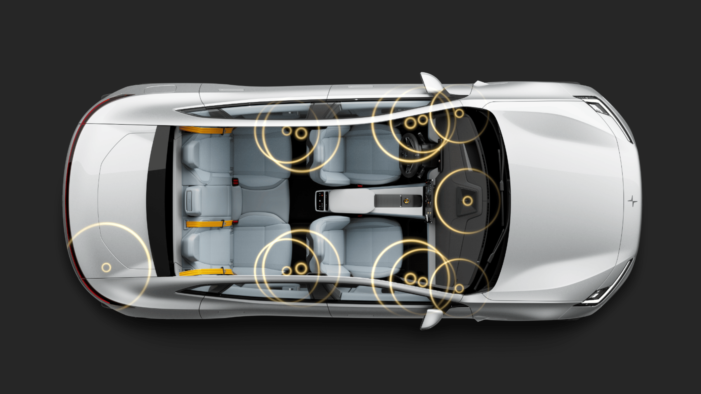 Bird’s eye view of Polestar 4 coupé showing audio speaker placement via graphic sound waves.