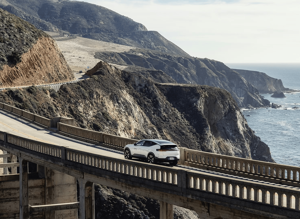 Polestar 3 driving on a coastal bridge