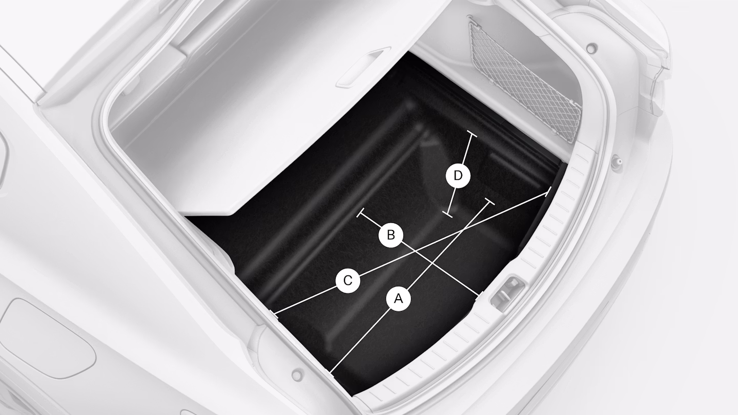 Polestar 2’s rear under floor storage compartment with lines and letters showing its measurements.