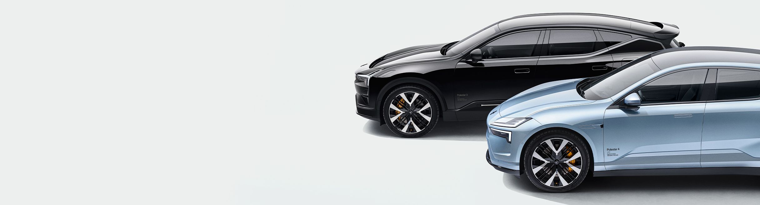 Polestar 3 and Polestar 4, one black and one light blue, shown in side view