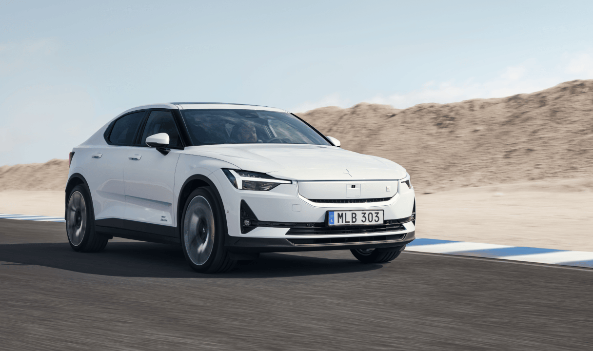 Polestar 2 driving on a road in a desert landscape