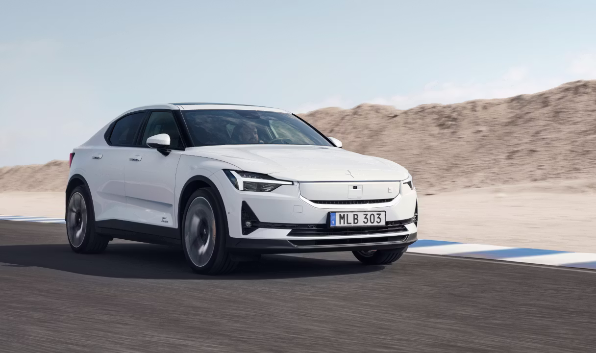 Polestar 2 driving on a road in a desert landscape