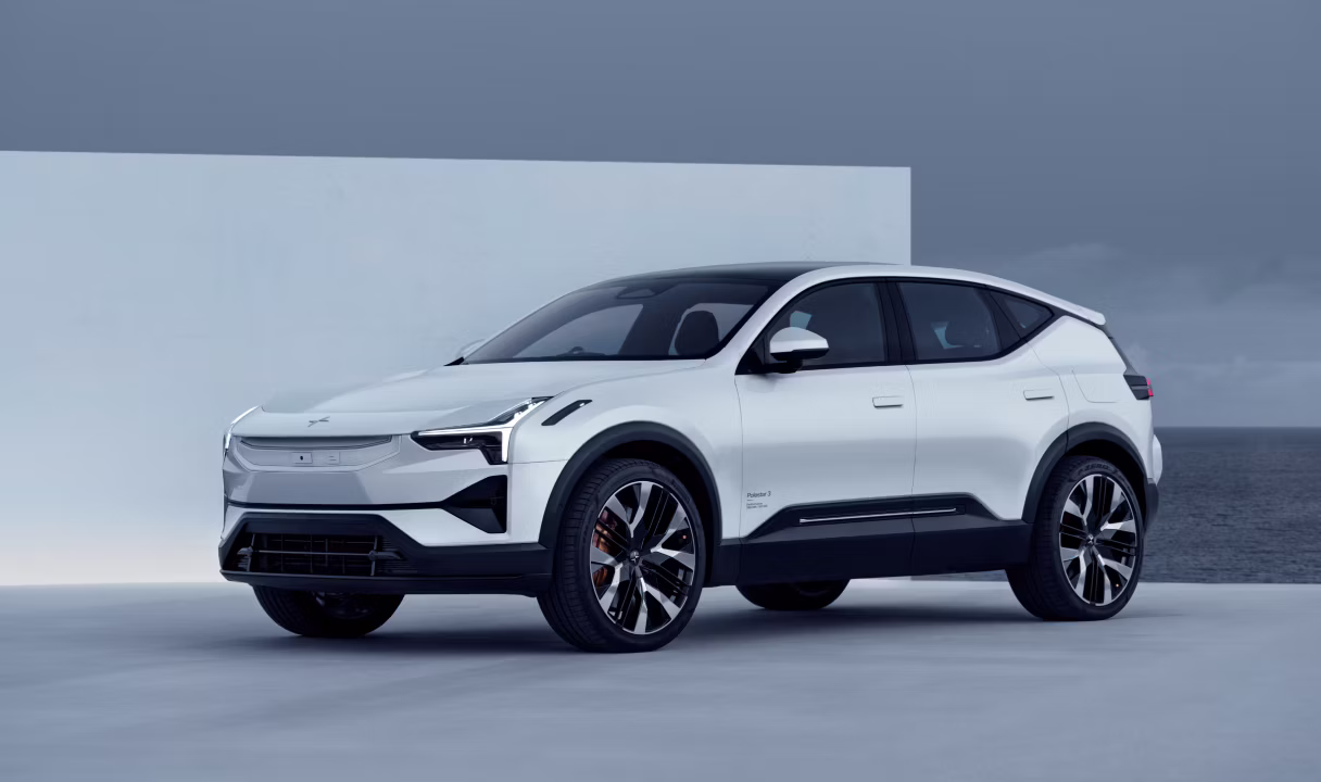 Polestar 3 SUV in front of a wall and ocean