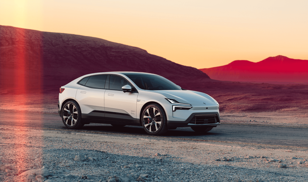 Polestar 4 coupé on a desert road at sunset