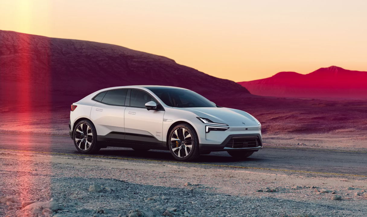 Polestar 4 coupé on a desert road at sunset
