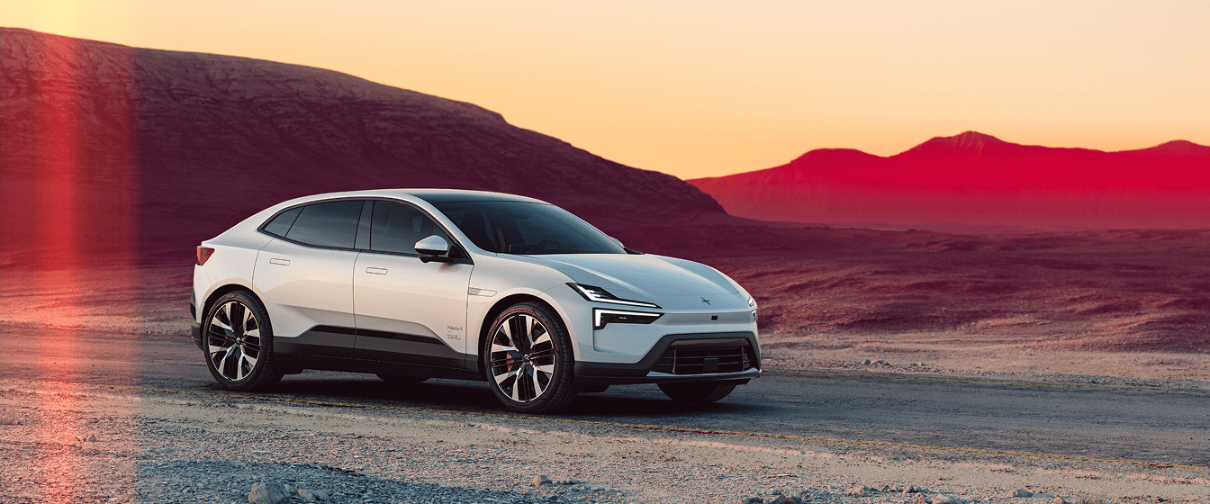 Polestar 4 coupé on a desert road at sunset