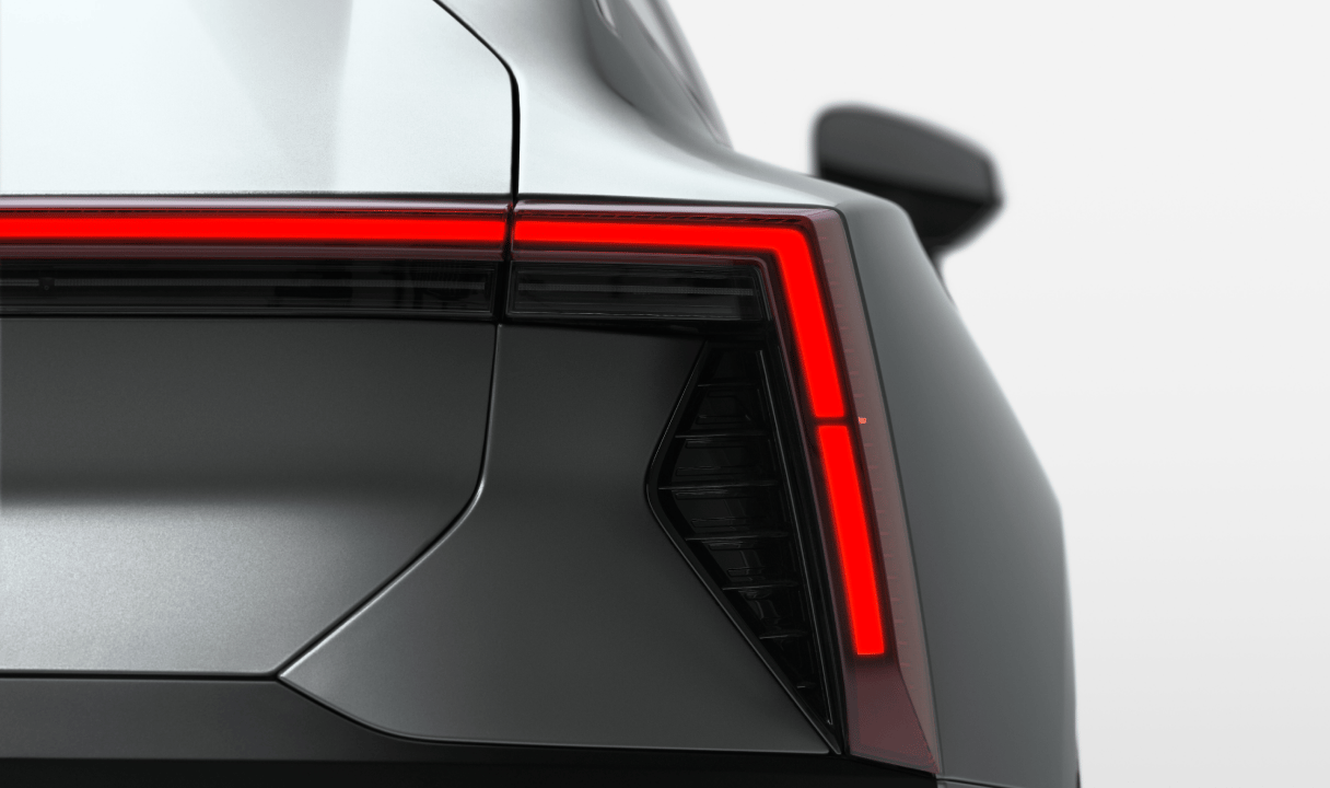 Rear corner of a Polestar 5 with illuminated taillight