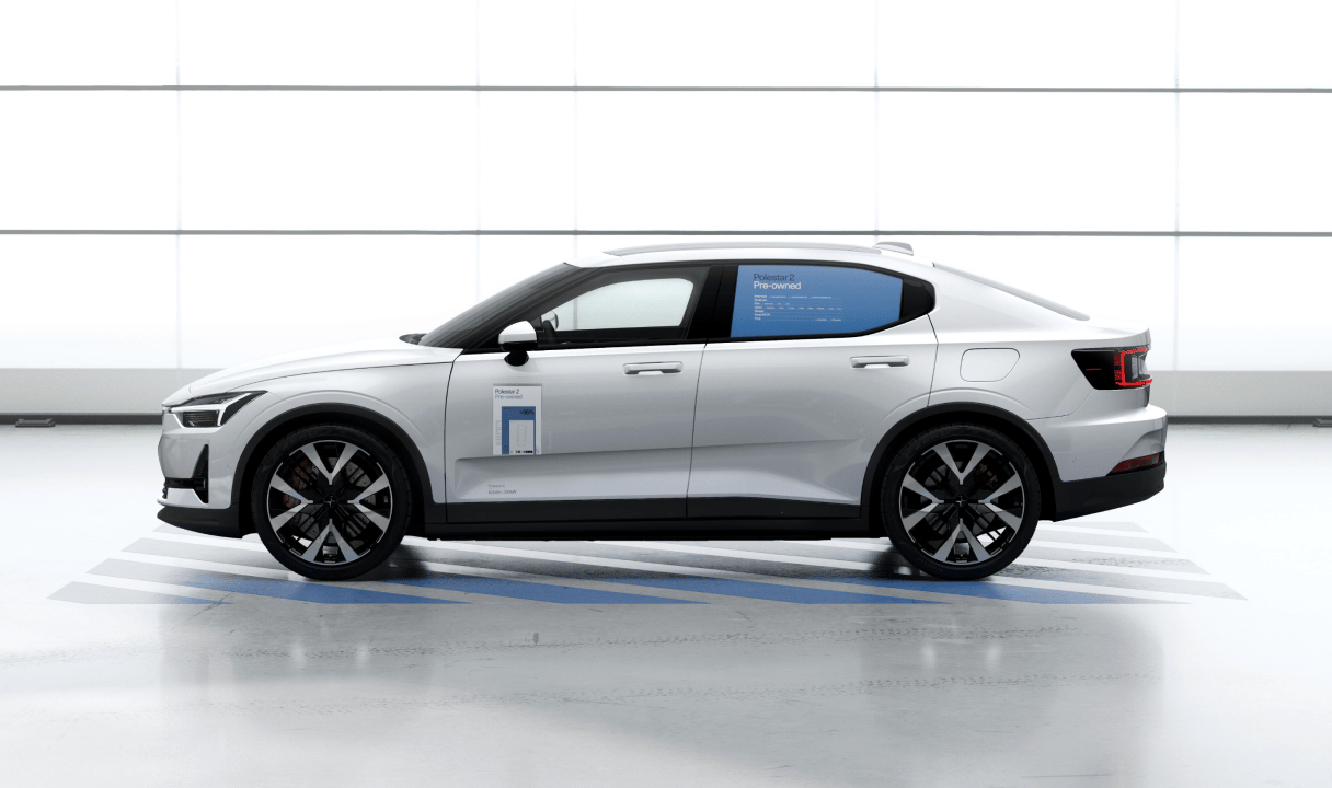 Polestar 2 in side view with pre-owned signage on the window