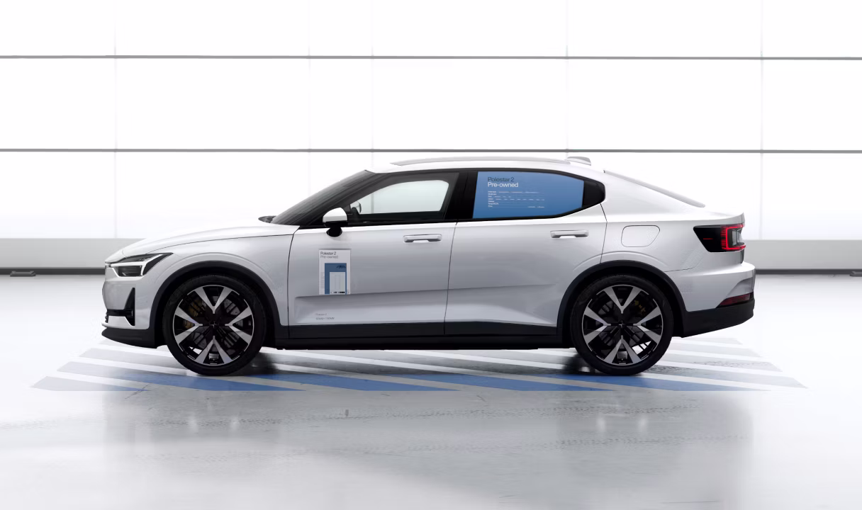 Polestar 2 in side view with pre-owned signage on the window