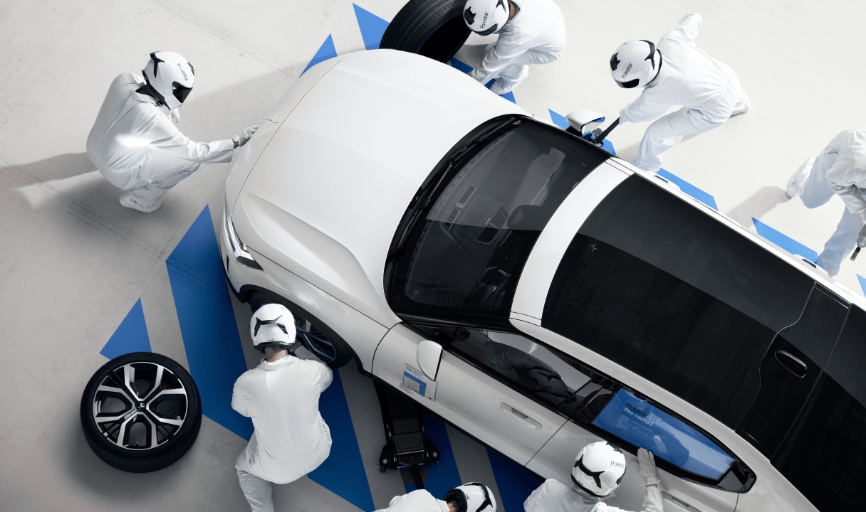 Polestar 2 being assembled by workers in a factory