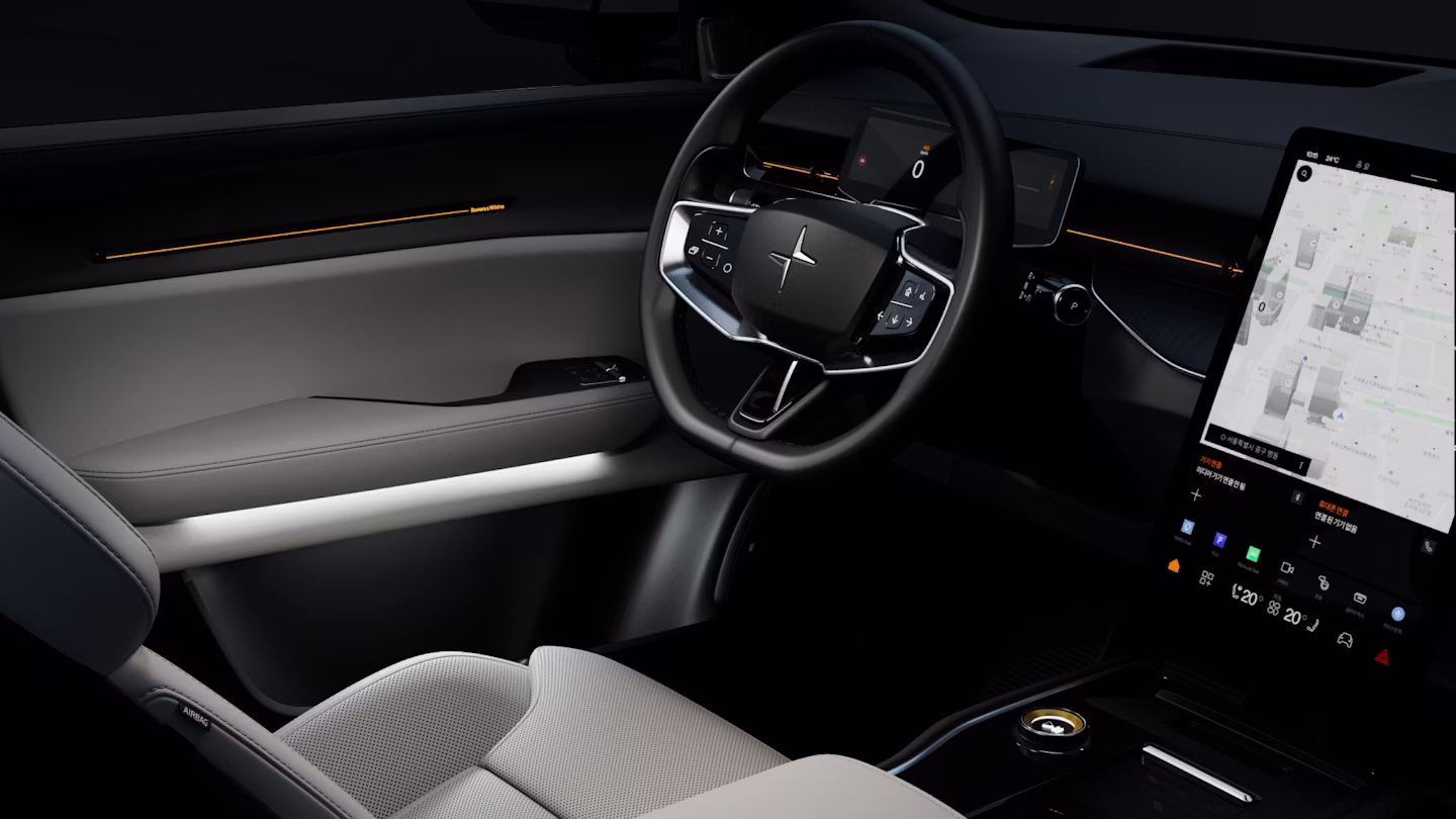 Polestar 3’s interior in a dark background lit up with its white, ambient interior lighting.