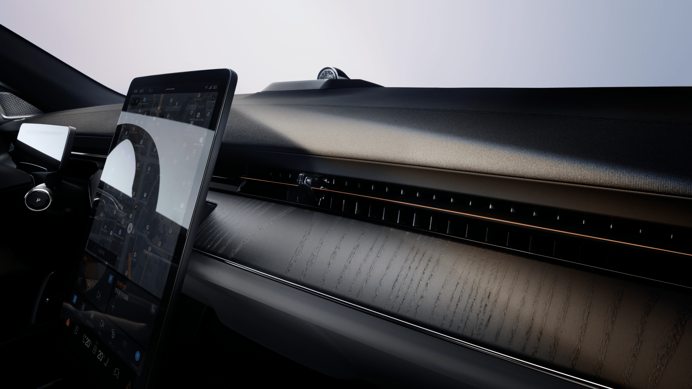 A panned view of Polestar 3’s dashboard in Charcoal colour, centre display, and windscreen.