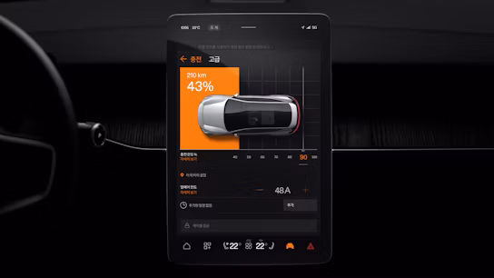 Car charging screen showing 43% battery and 210 km range with a top-down car graphic