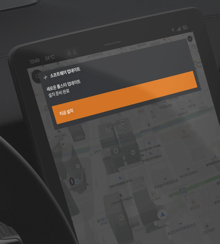 Car dashboard screen showing a software update prompt over a map