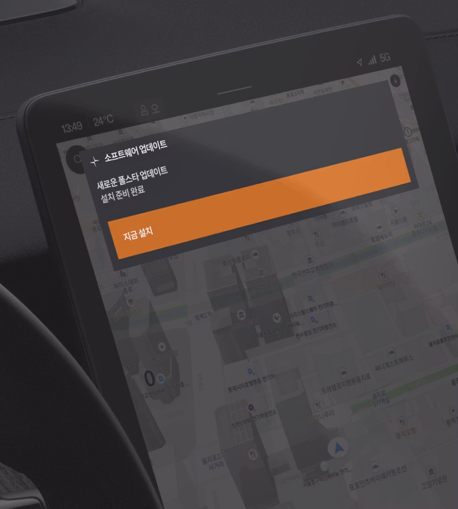 Car dashboard screen showing a software update prompt over a map