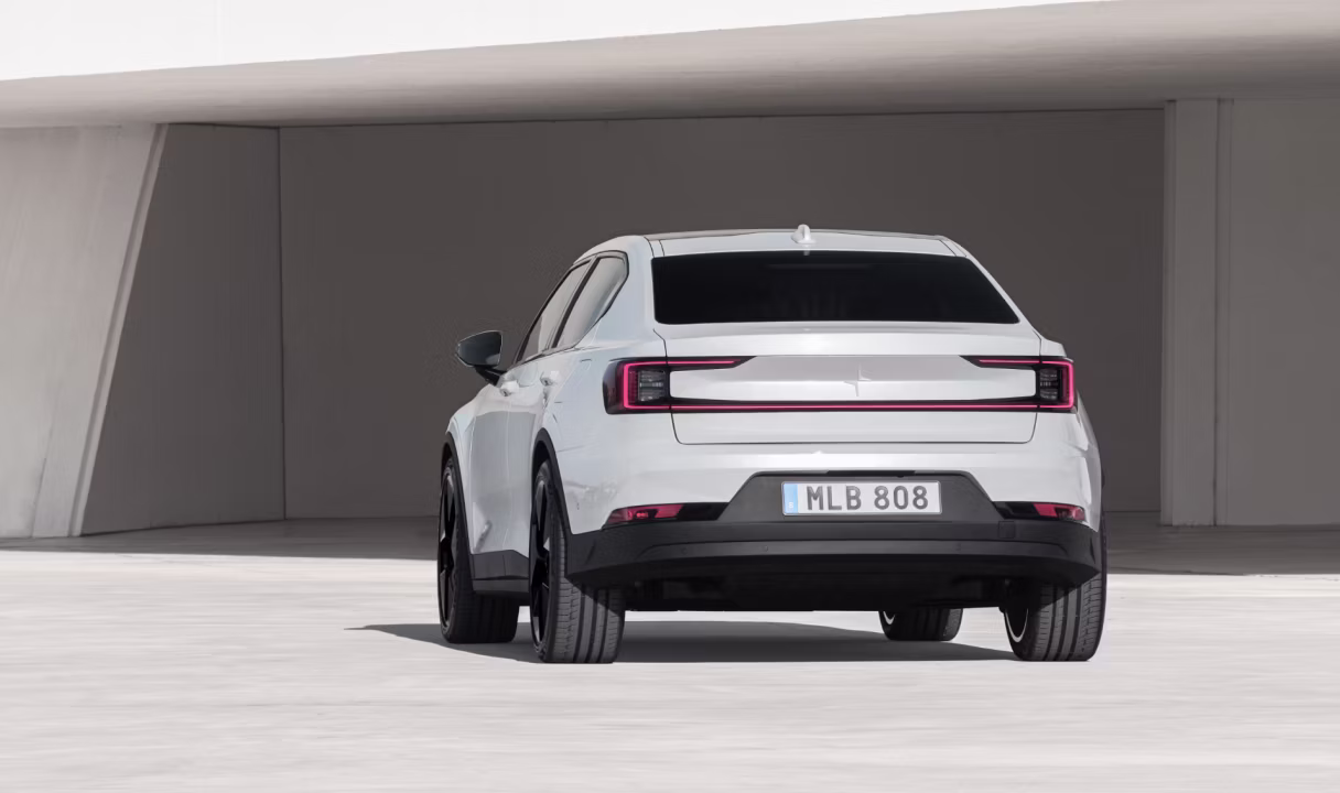 Polestar 2 seen from the rear in a modern concrete structure