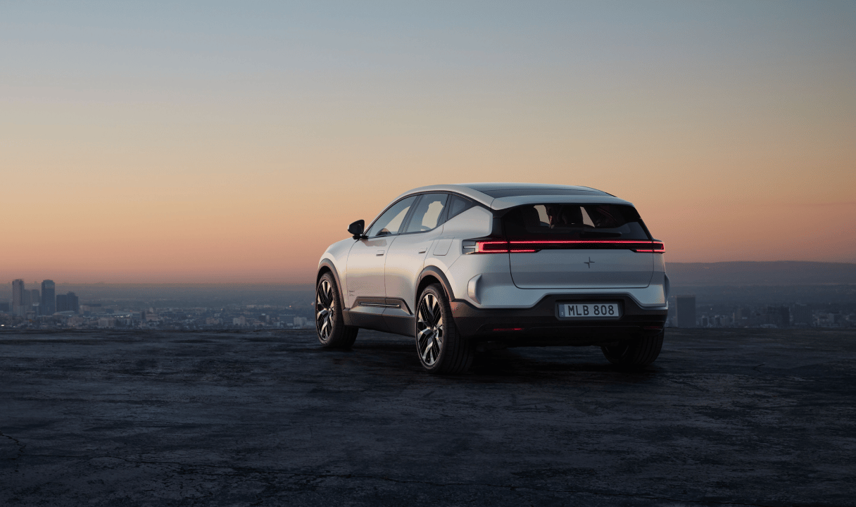 Polestar 3 SUV viewed from the rear on a hilltop at sunset