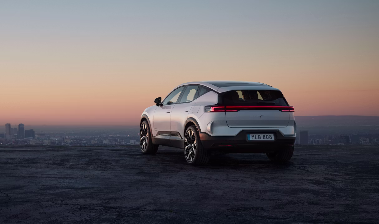 Polestar 3 SUV viewed from the rear on a hilltop at sunset