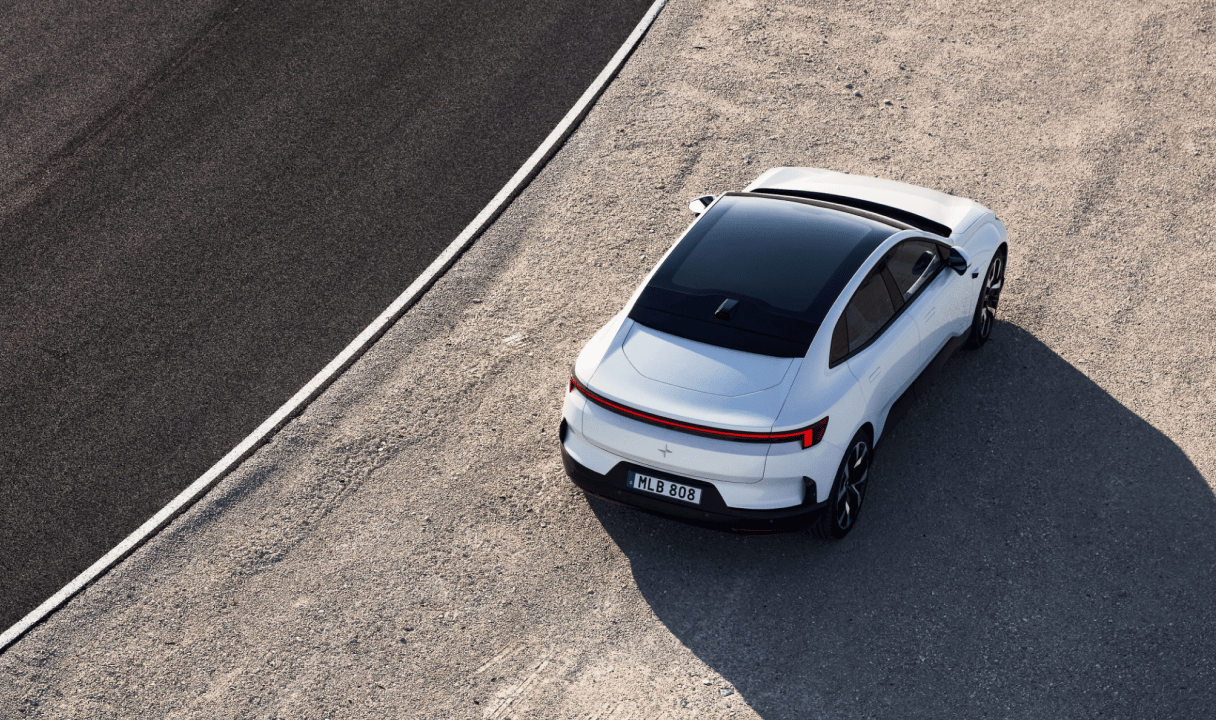 Polestar 4 Coupé parked on gravel beside a road
