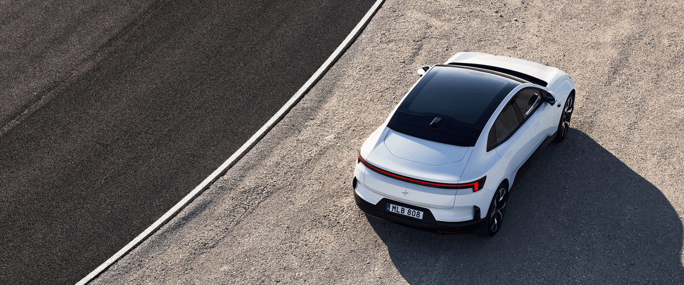 Polestar 4 Coupé parked on gravel beside a road