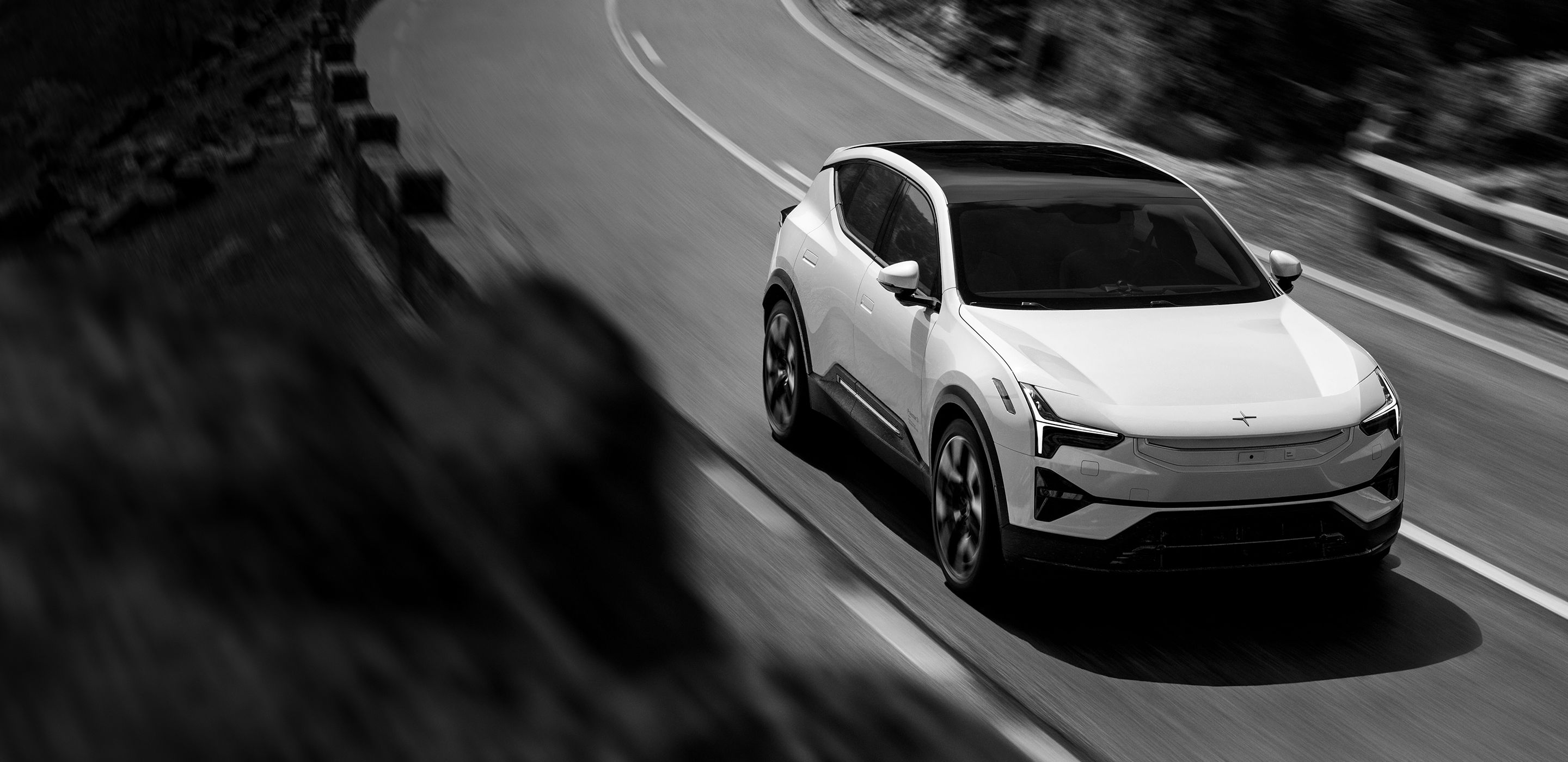 Polestar 3 driving on a curving road