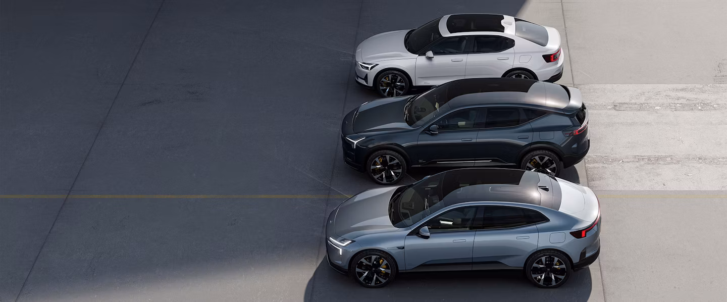 Three Polestar cars parked side by side on a paved surface, viewed from above