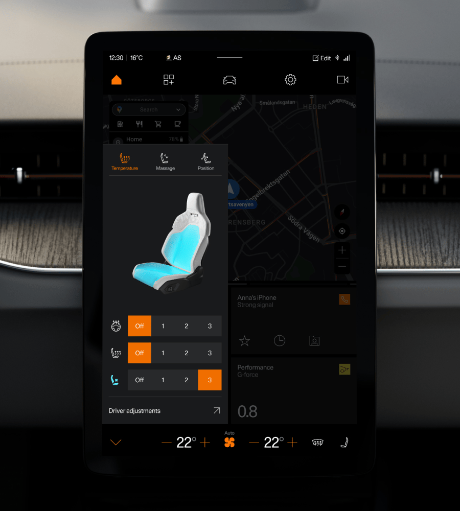 Car infotainment screen showing seat temperature and massage settings over a map