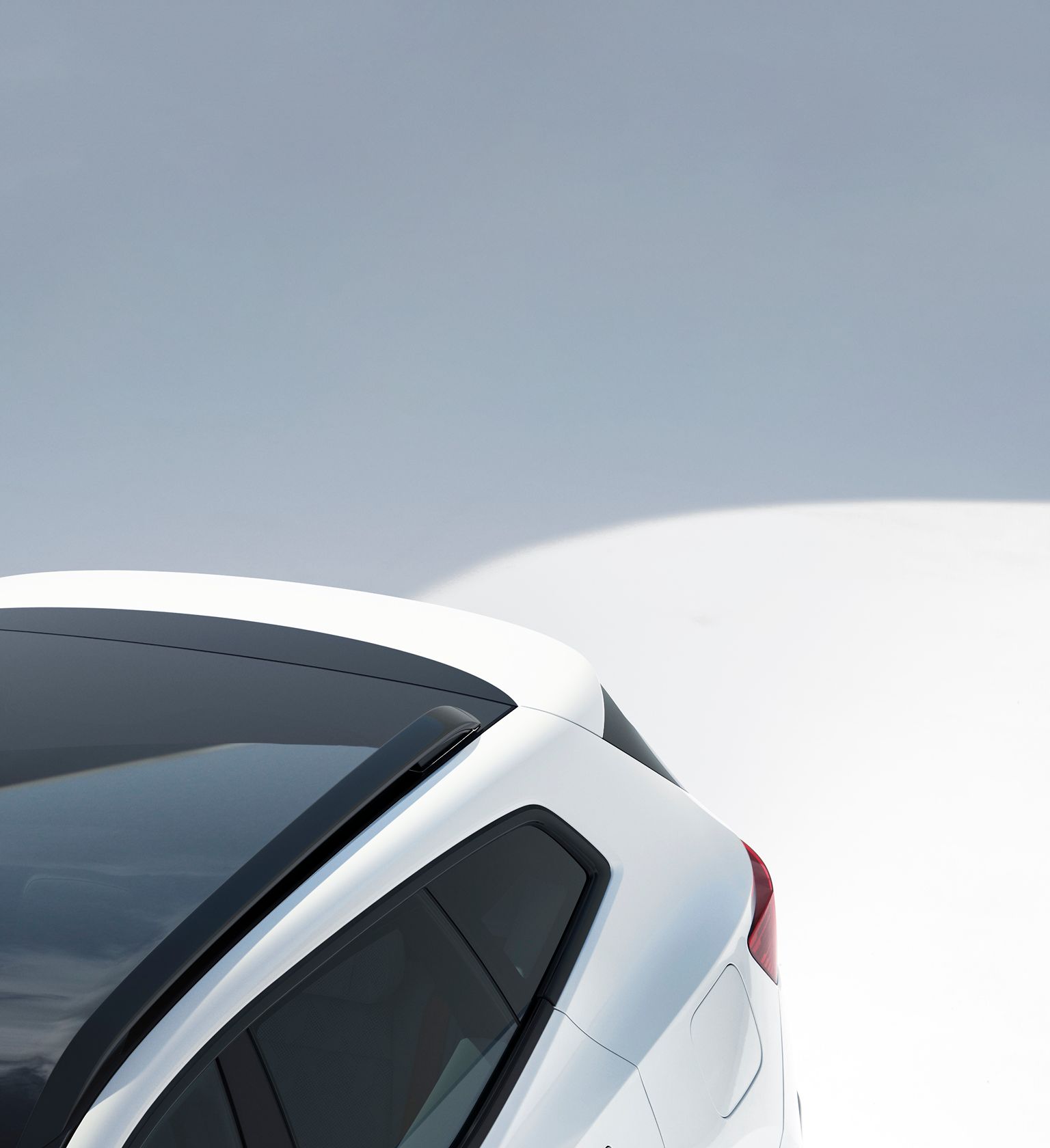 Rear corner of a white Polestar 4 SUV with tinted windows and roofline