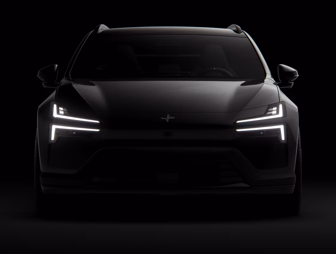 A black Polestar 4 SUV facing forward and standing against a black background.