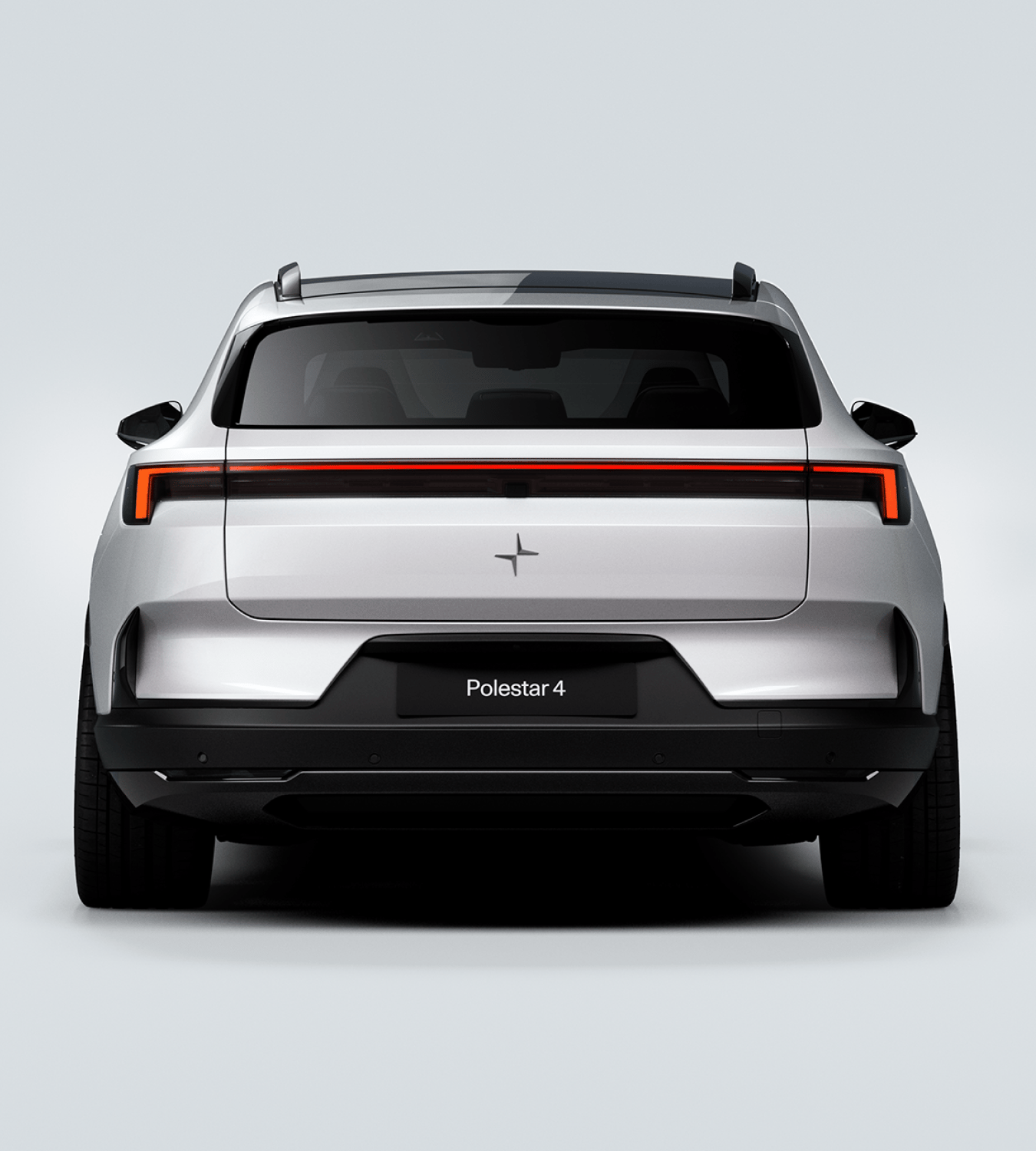 Rear profile view of a white Polestar 4 SUV in a white background.