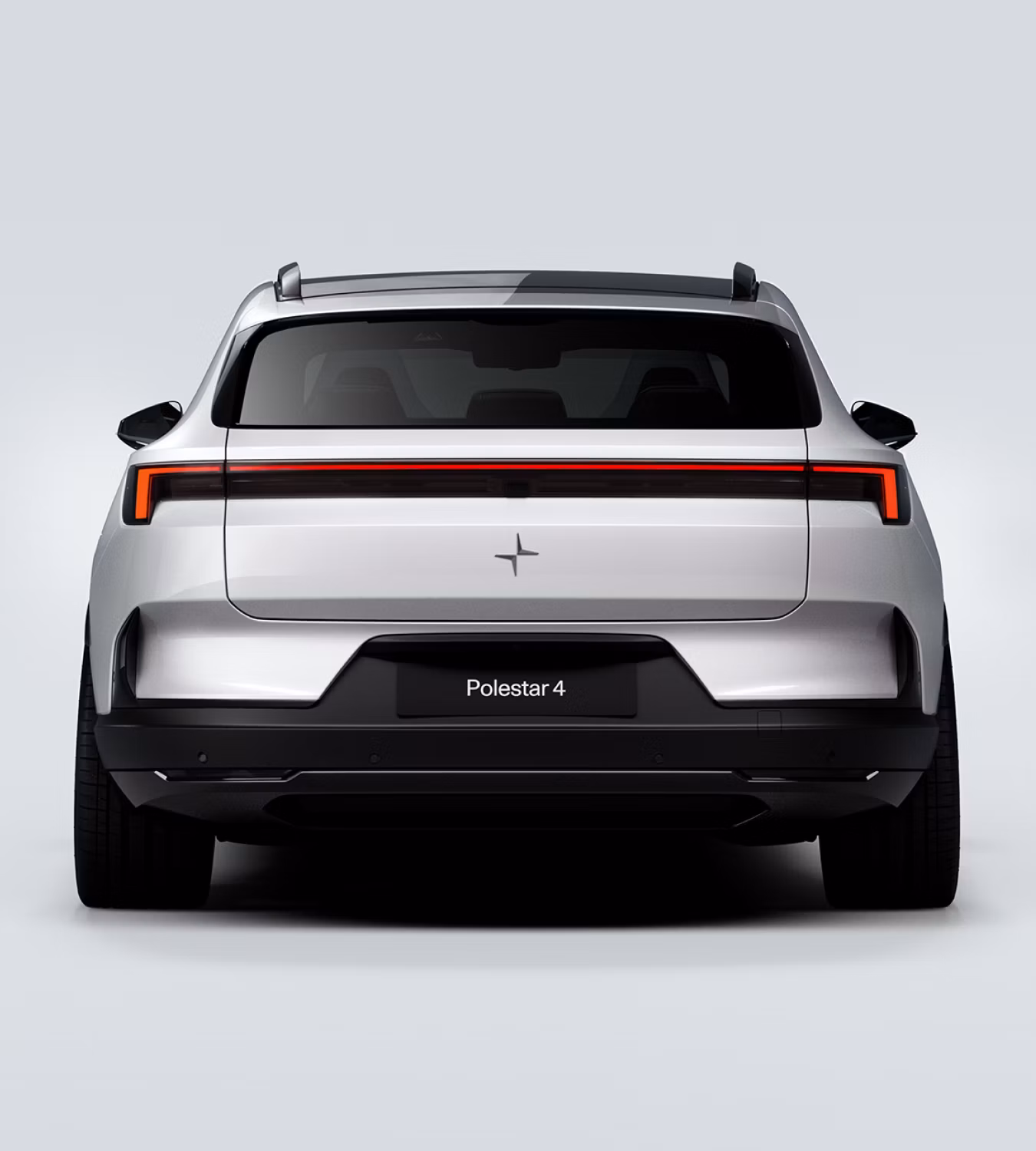 Rear profile view of a white Polestar 4 SUV in a white background.