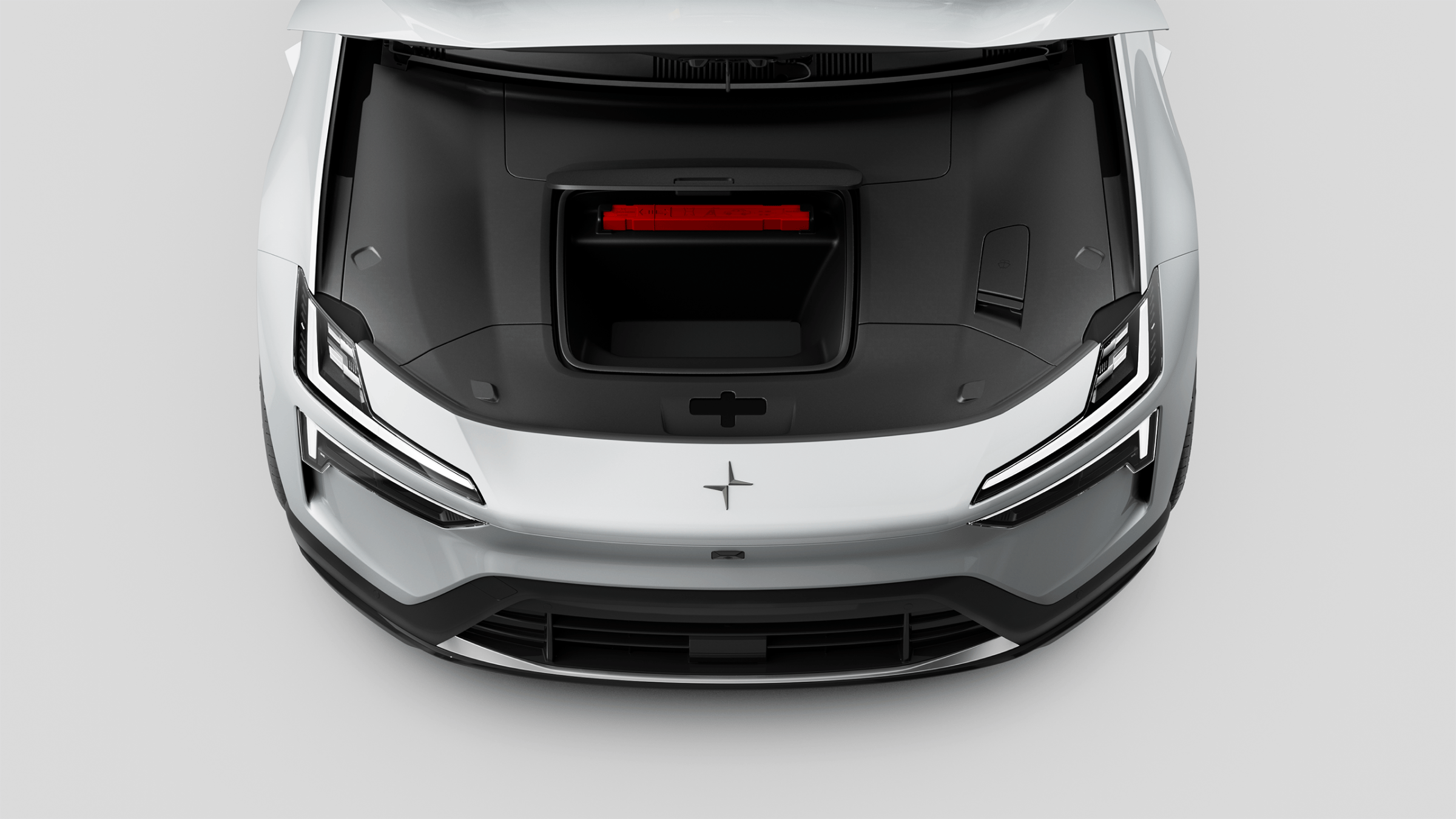 A top down view of Polestar 4 SUV’s front compartment with roof raised up.