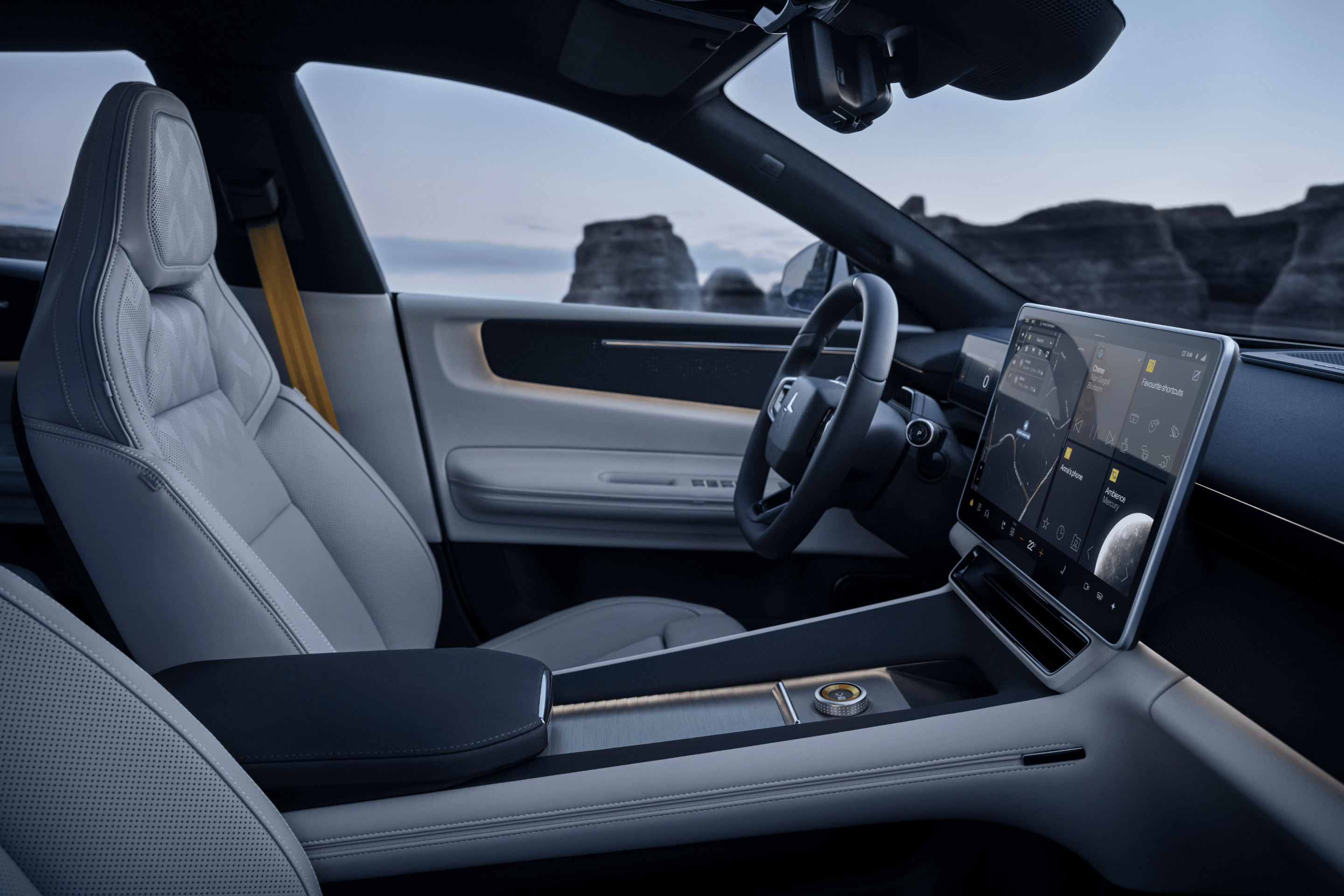 Interior view of Polestar 4 SUV's white interior with the ocean and sea cliffs in the background.
