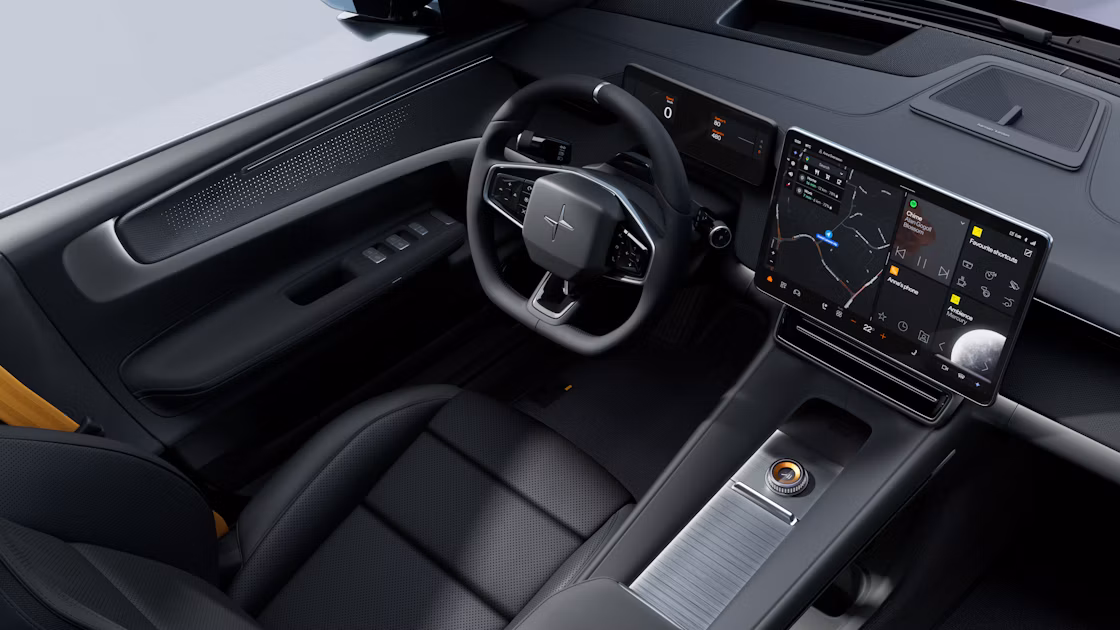 Polestar 4 SUV’s front area showing the steering wheel, dashboard, and centre display.