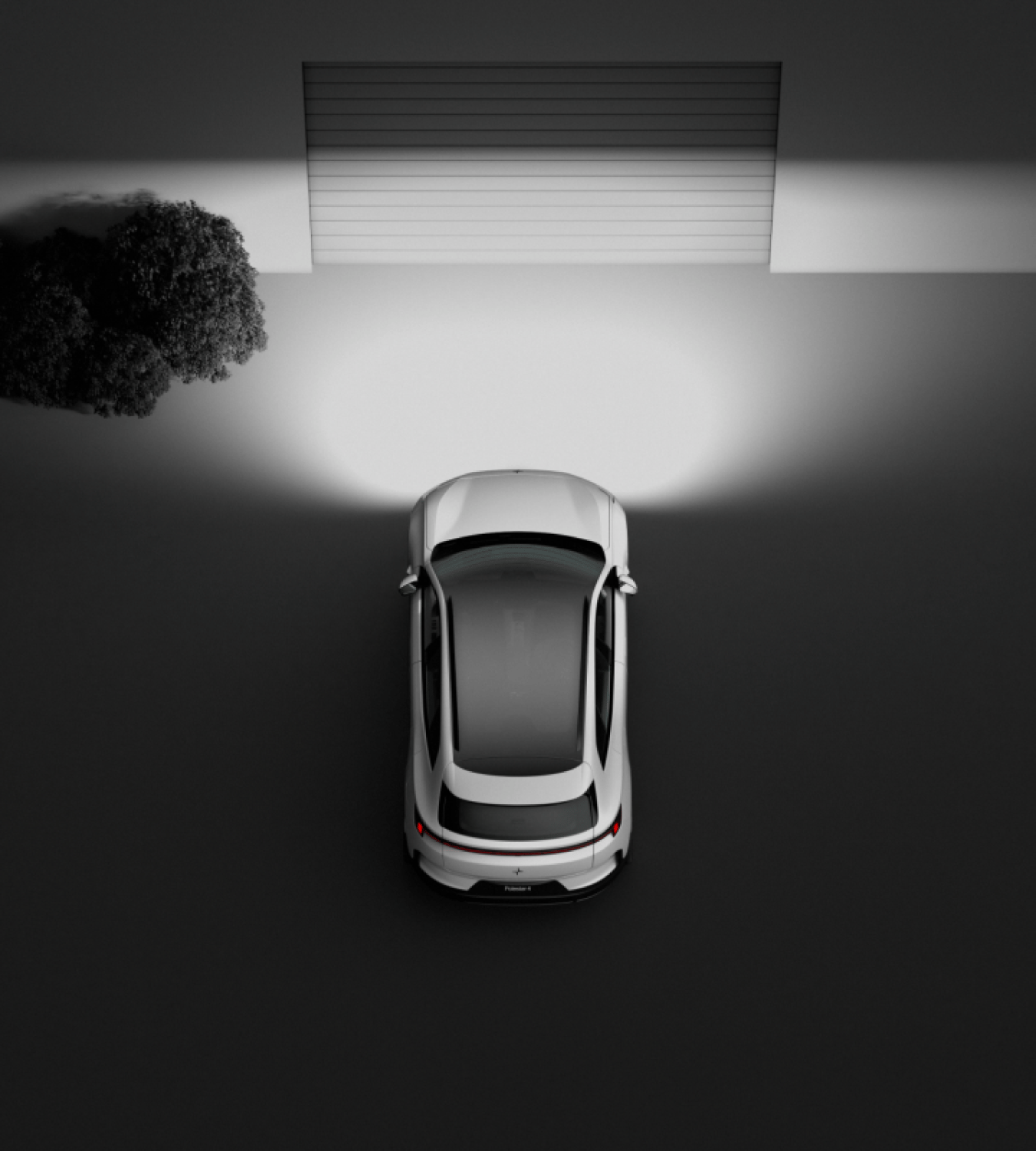 Polestar 4 SUV shining its headlights onto a closed garage door.