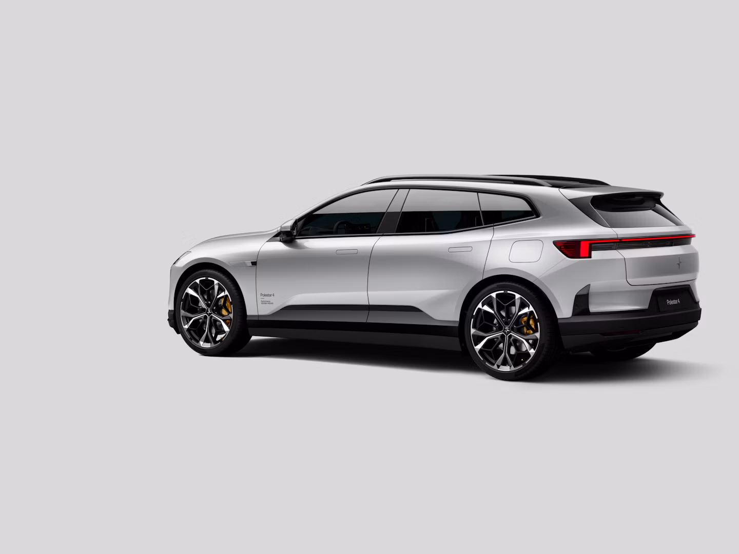 Polestar 4 SUV in color Lightning in rear three-quarter view on a plain background