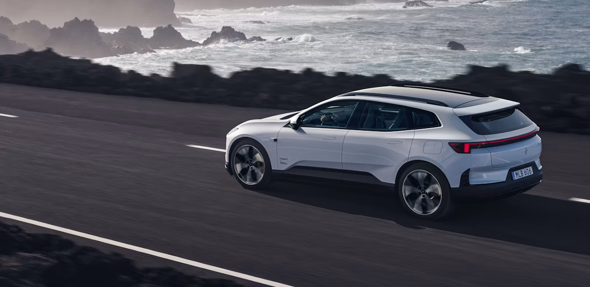 Polestar 4 SUV driving on a coastal road