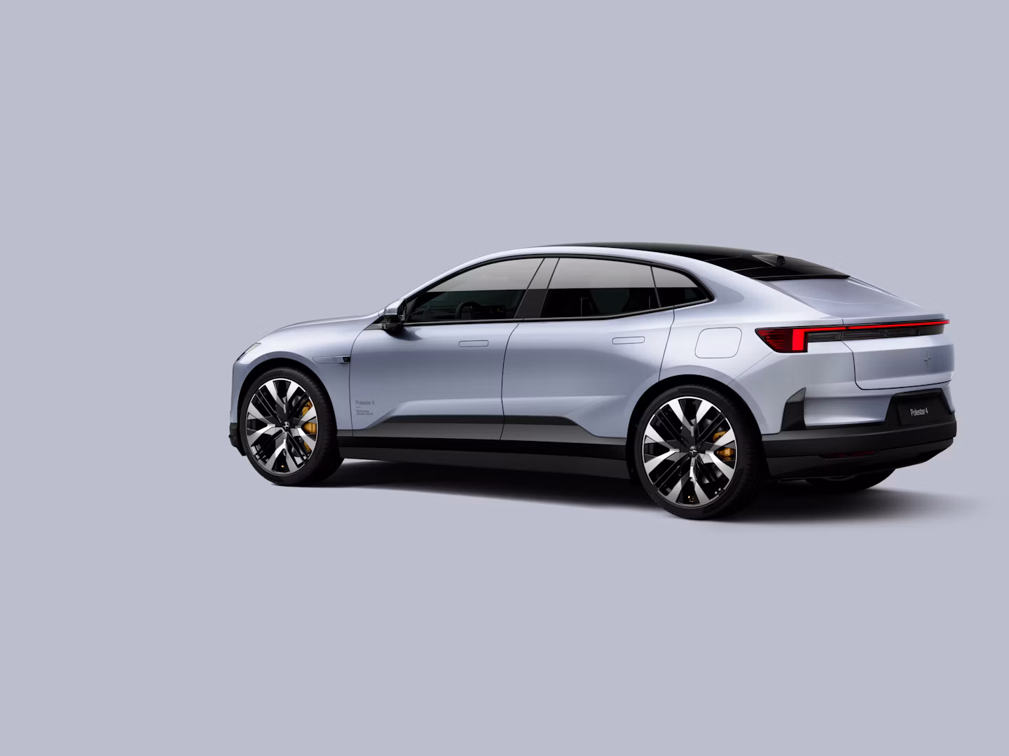Polestar 4 coupé shown from the rear side on a plain background