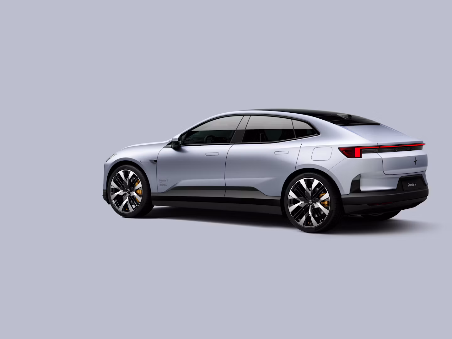 Polestar 4 coupé shown from the rear side on a plain background