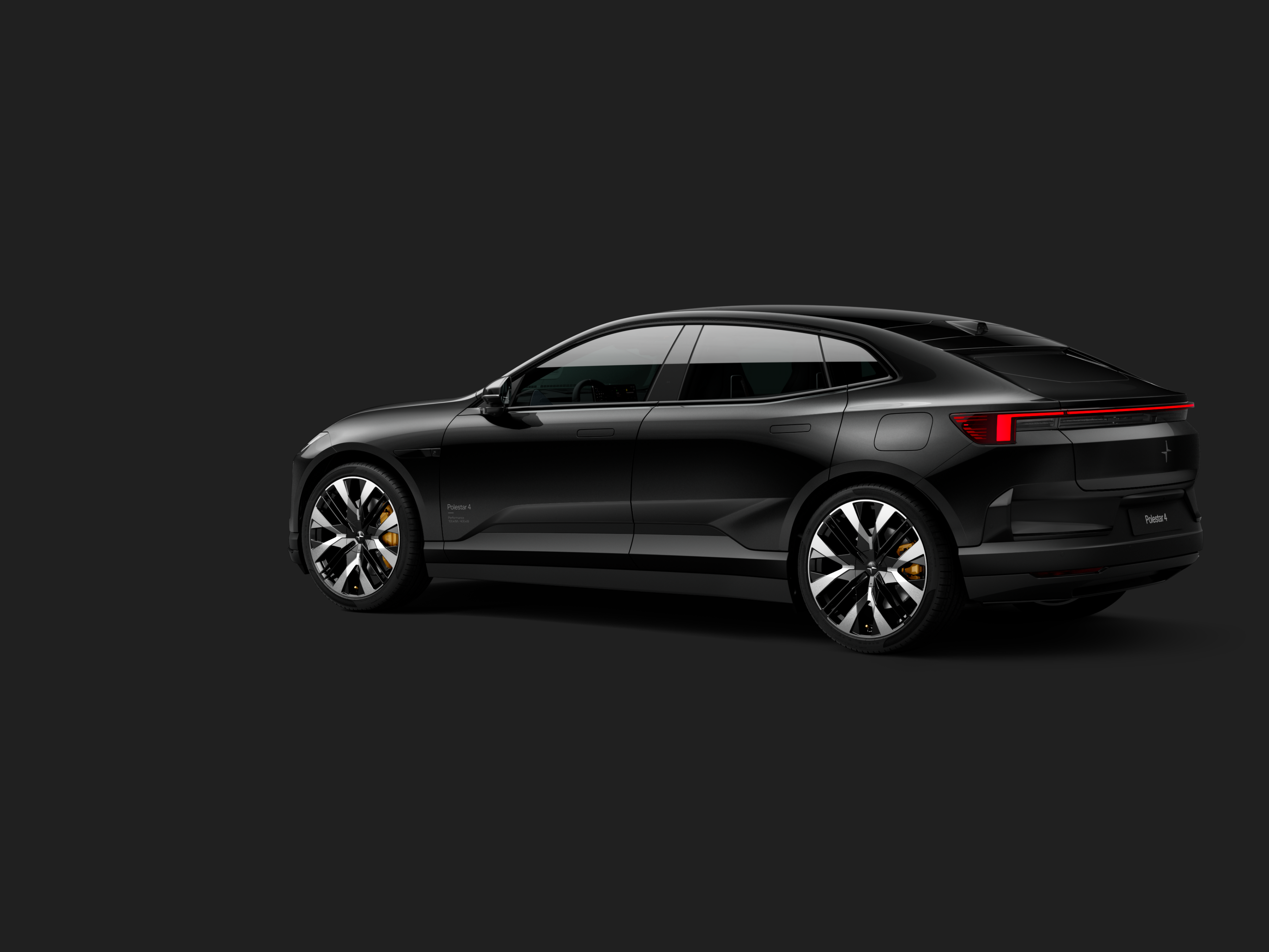 Polestar 4 coupé shown from the rear side on a dark background