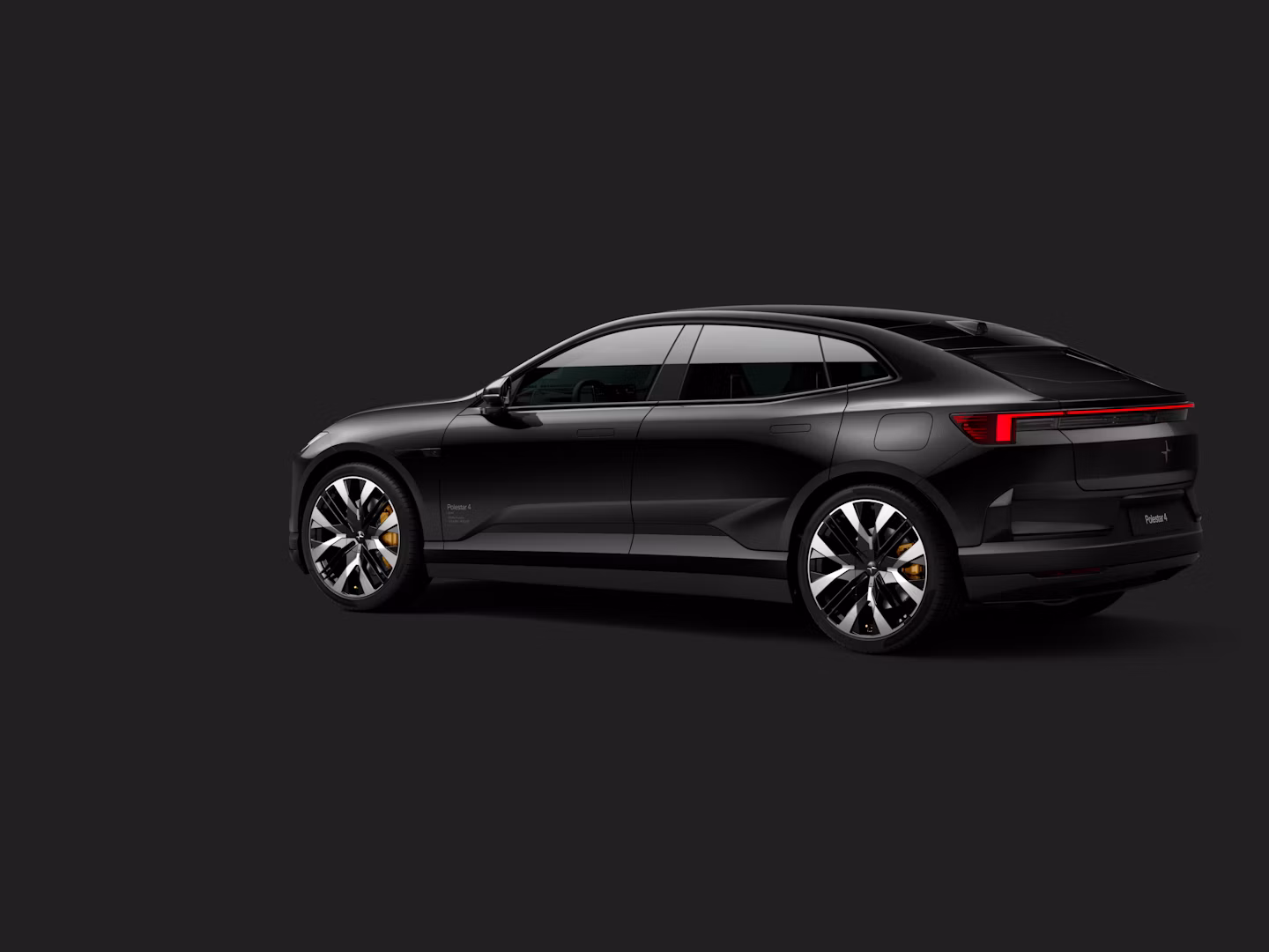 Polestar 4 coupé shown from the rear side on a dark background