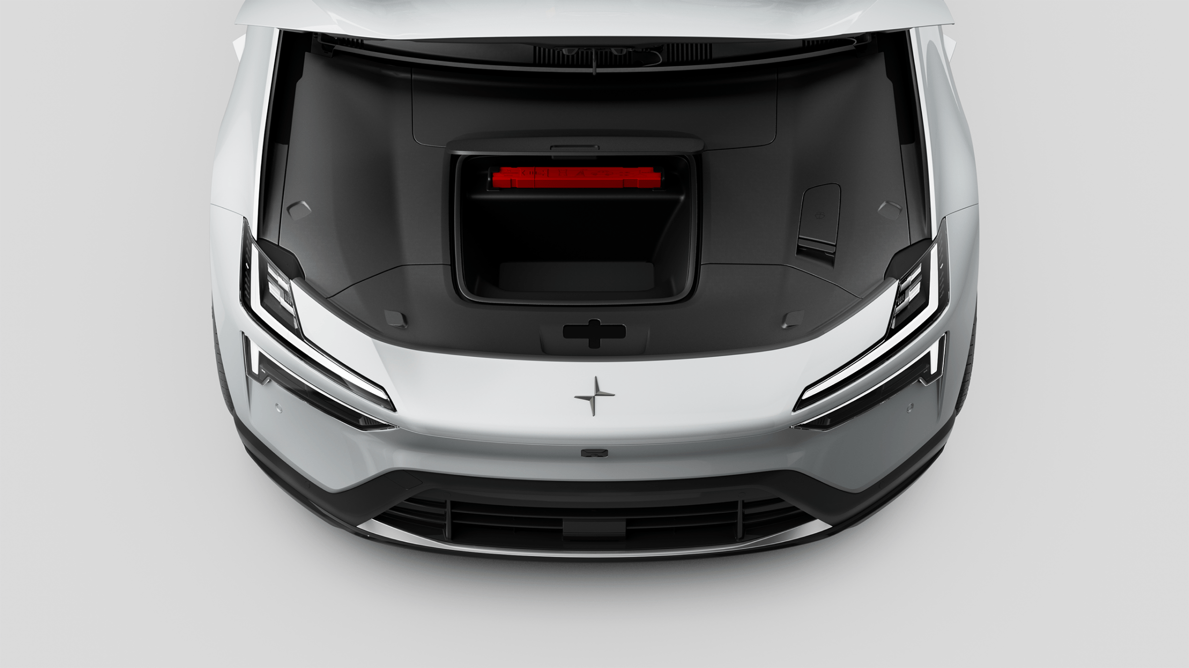 A top down view of Polestar 4 SUV’s front compartment with roof raised up.