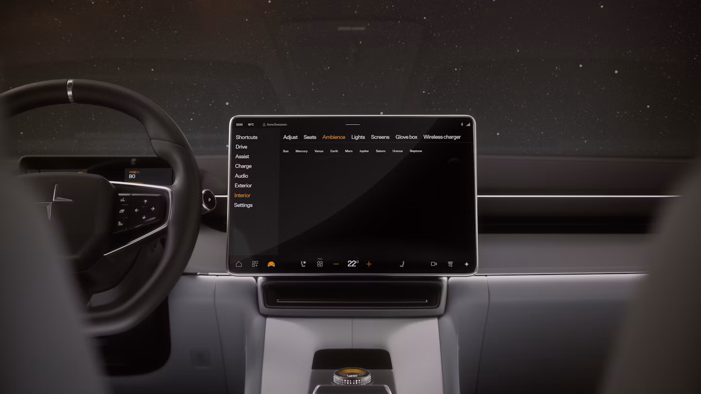 Polestar 4 coupé’s front area showing the steering wheel, dashboard, and centre display.